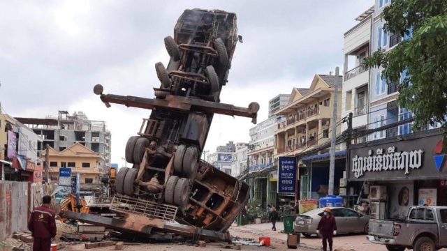 Kato crane overturned on vehicles in Sihanoukville